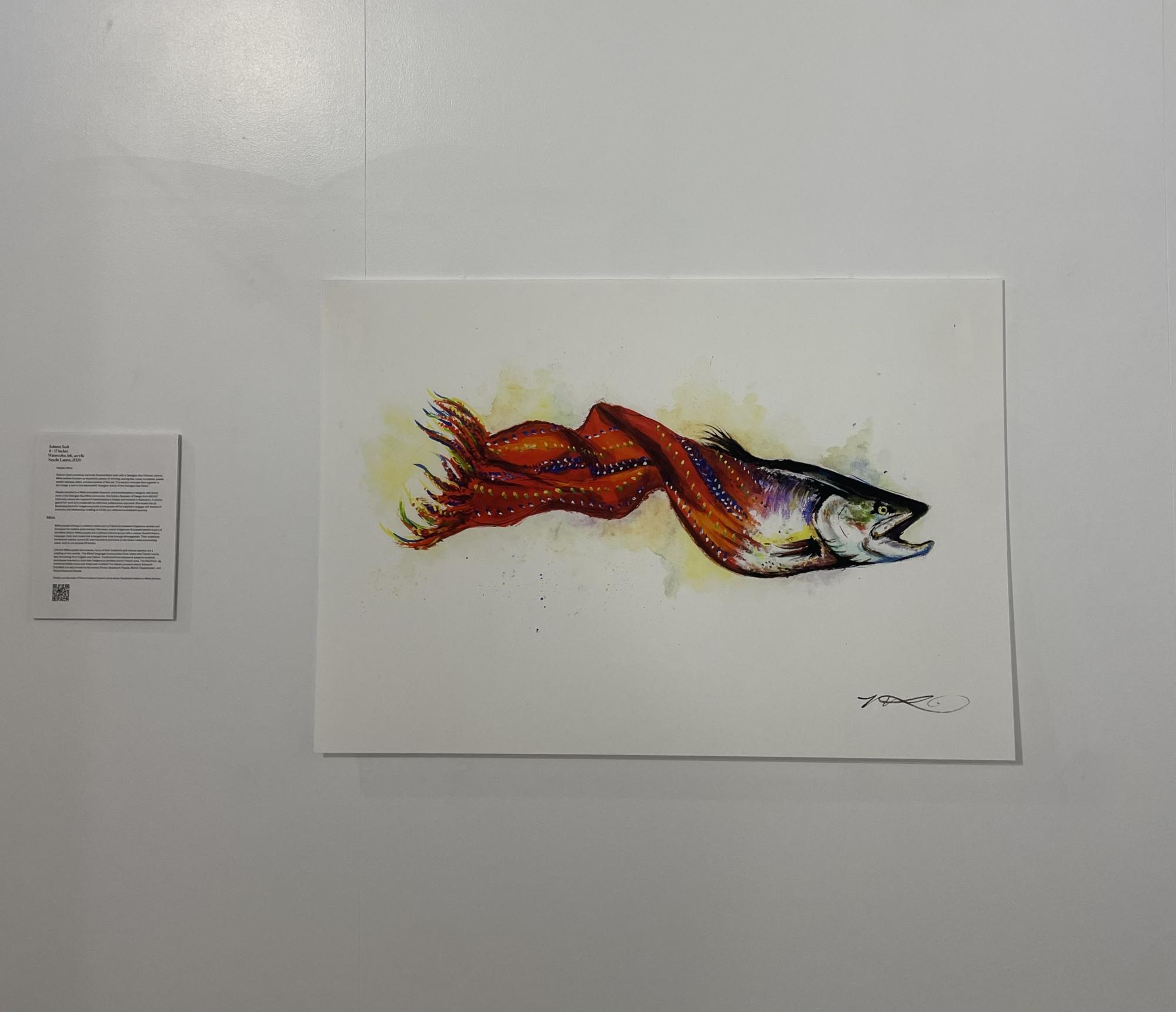 [ID: "Watercolour, ink, and acrylic illustration of a Georgian Bay chinook salmon swimming off to the right with its mouth open. Its tail morphs into a red Métis sash halfway down its body."]