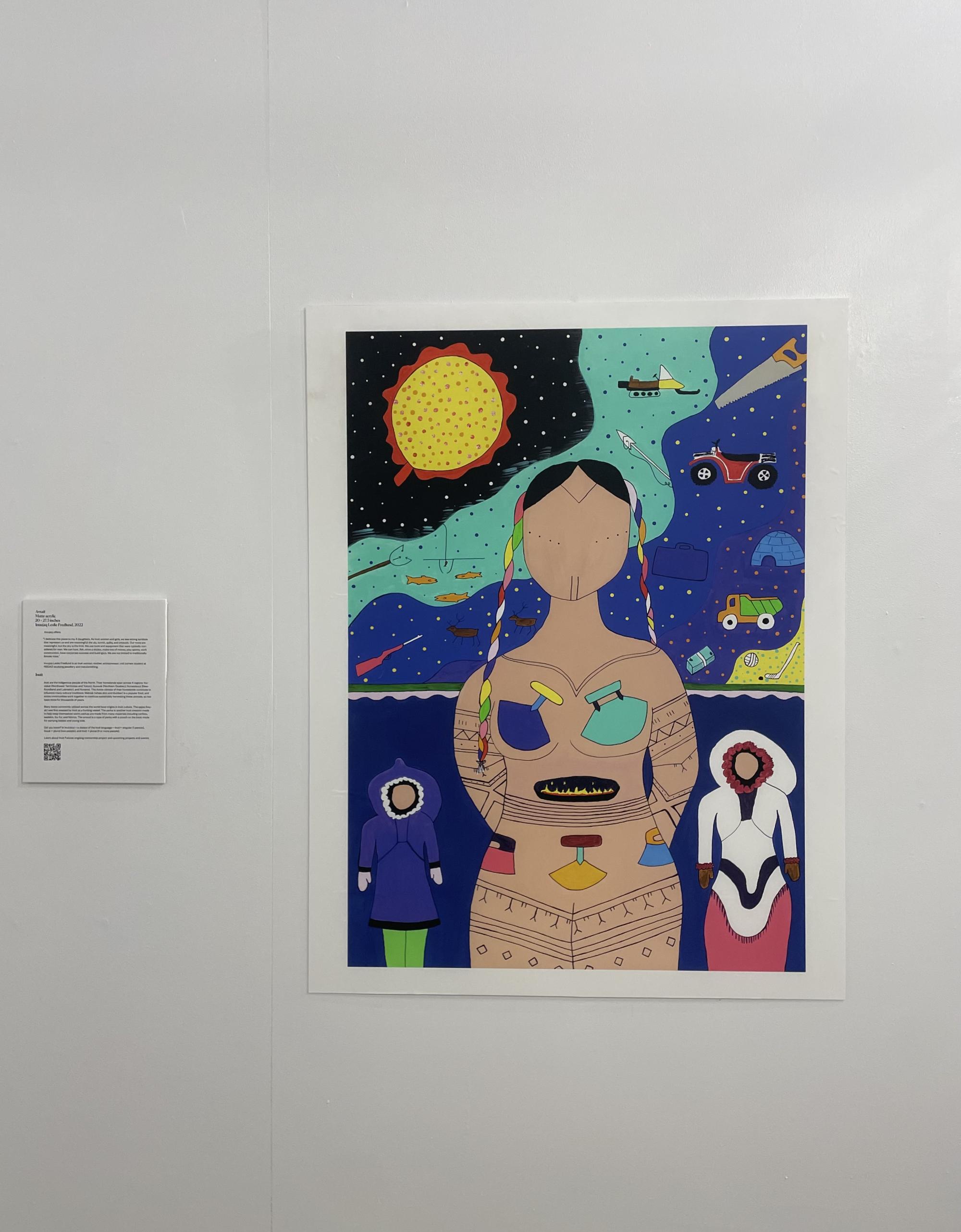 [ID: "Matte acrylic paint on paper of 3 female figures in the foreground wearing and displaying various Inuit symbols and items such as uluit and amautiit. The sky in the background is teal, purple, blue, black, and yellow with many illustrations including a 4-wheeler, igloo, and saw."]