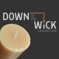 a gray square with text reading "down to the wick" and tan candle in lower left