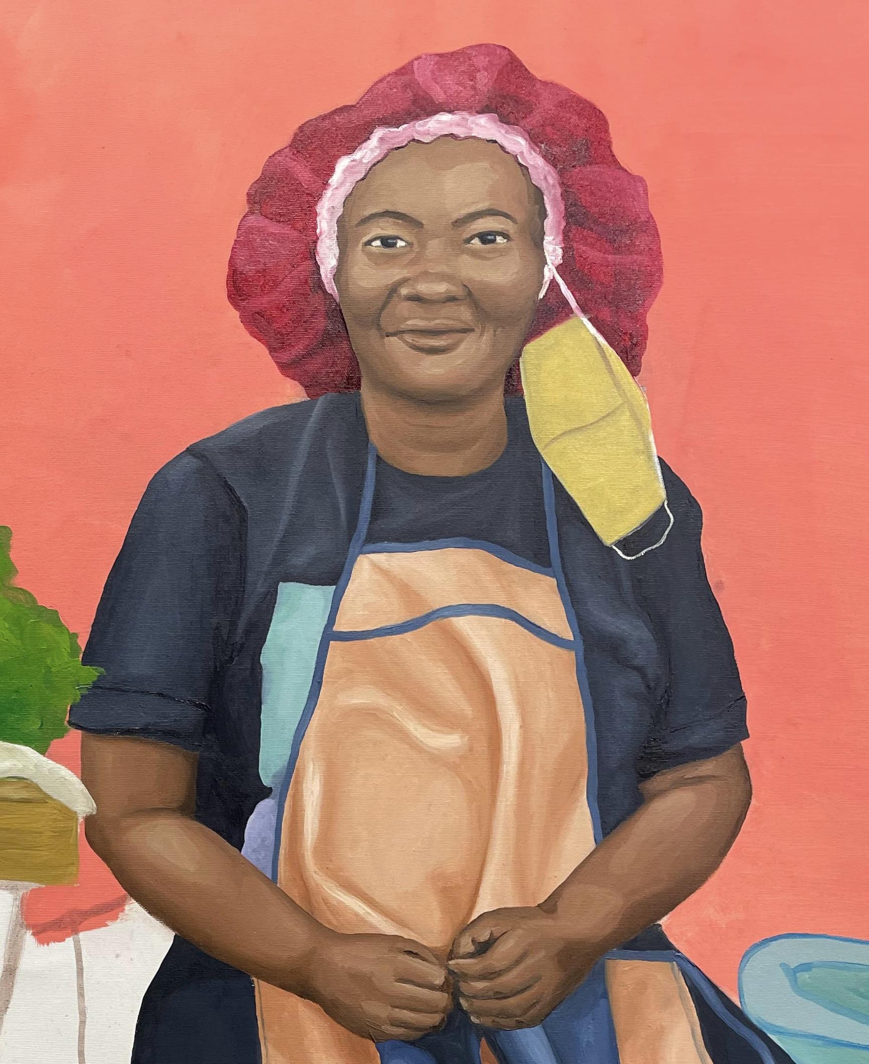 Portrait of brown skinned woman with a red bonnet, yellow mask, blue shirt and light brown apron infront a bright orange wall