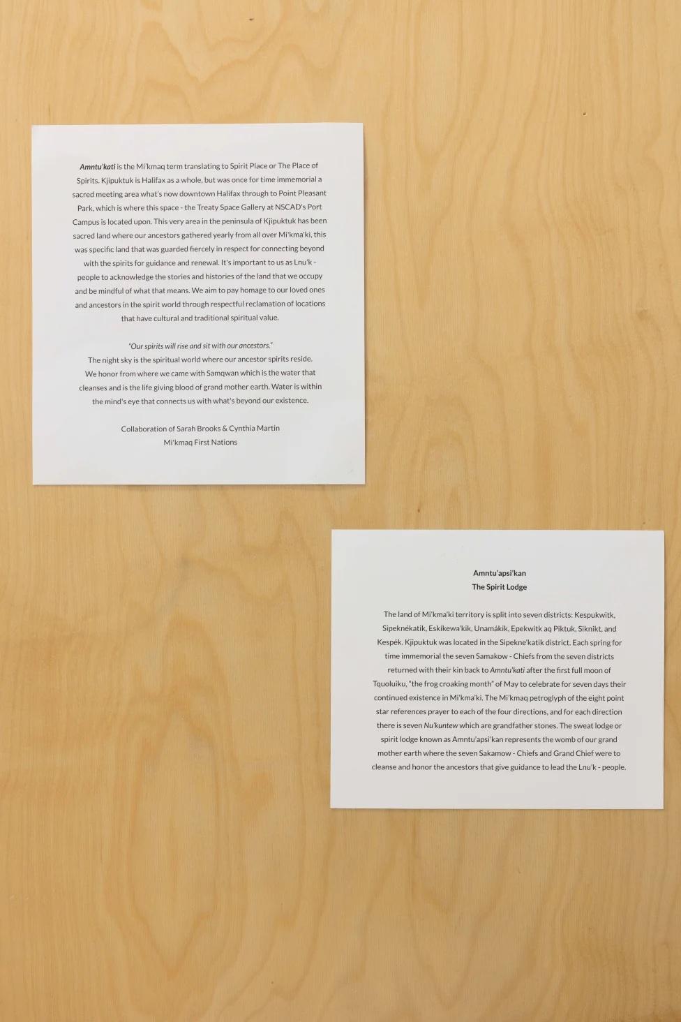 Photos of exhibition text mounted on the baltic birch wall