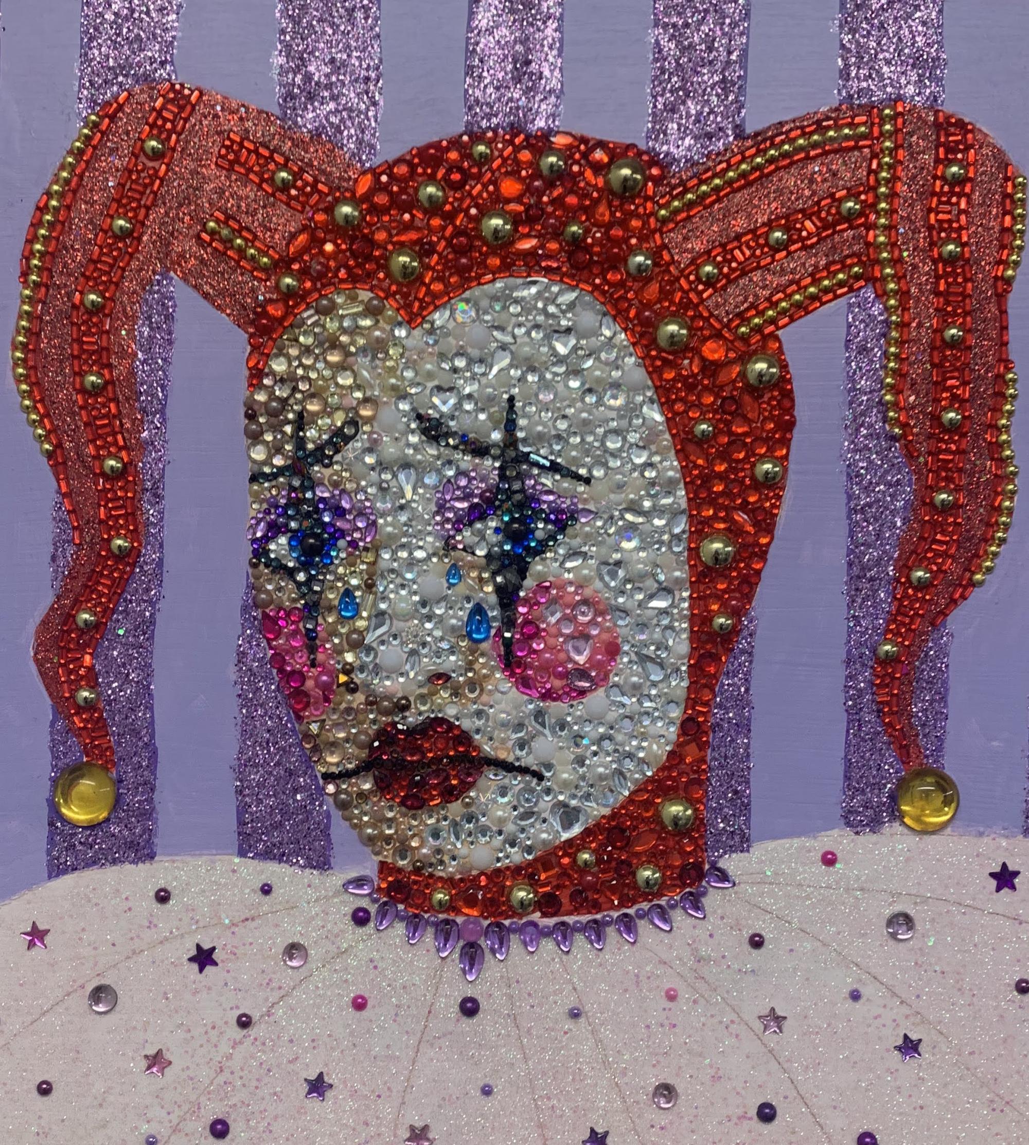 Portrait of a sad clown made with assorted rhinestones. Clown wears a red jester hat.