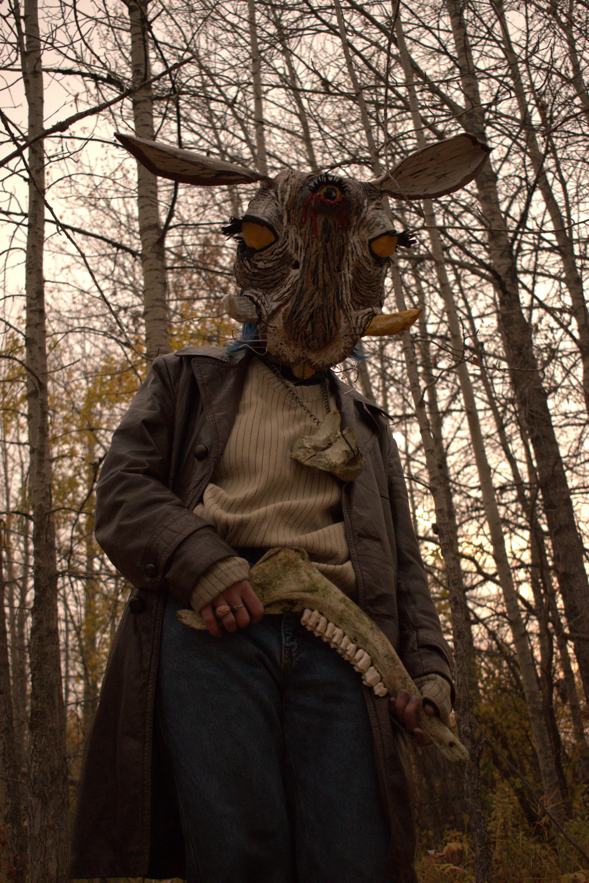 Then Prairie Hare piece, a hare mask with tusks and a third eye holding a jawbone in the woods