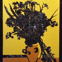 Dark silhouette of flowers in a brown vase on a brown table with bright yellow background.
