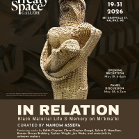 Basket woven sculpture in the form of a woman holding a baby.